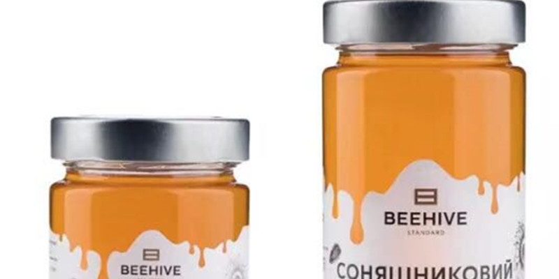 Transparent sealed thin tall one-pound honey jar (3)