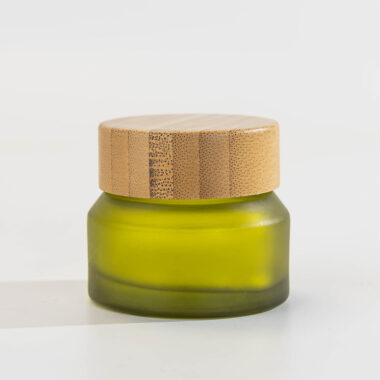 Green glass cosmetic jars with bamboo lids
