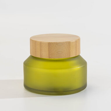Green glass cosmetic jars with bamboo lids