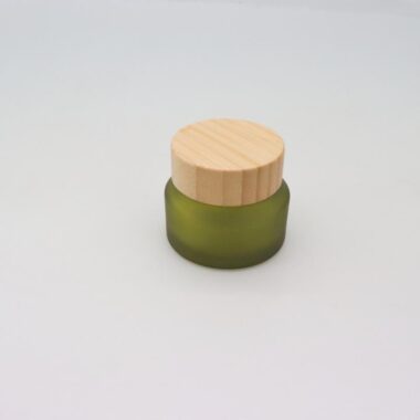 Green glass cosmetic jars with bamboo lids
