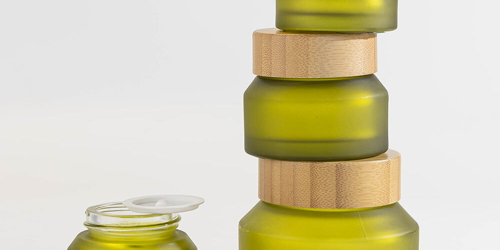Green glass cosmetic jars with bamboo lids