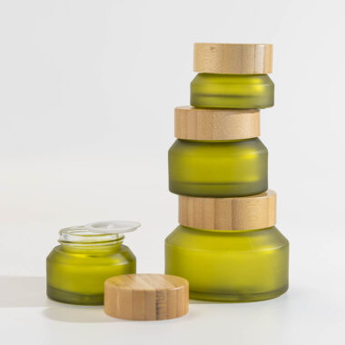 Green glass cosmetic jars with bamboo lids