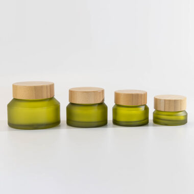 Green glass cosmetic jars with bamboo lids