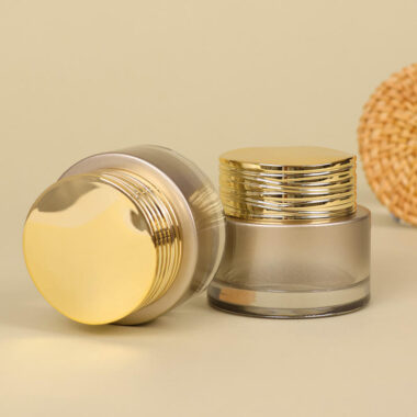 Frosted wide-mouth glass cosmetic jars with gold screw lids