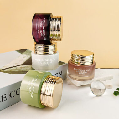 Frosted wide-mouth glass cosmetic jars with gold screw lids