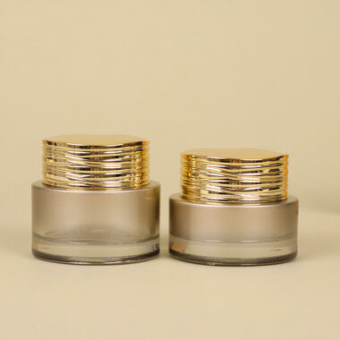Frosted wide-mouth glass cosmetic jars with gold screw lids