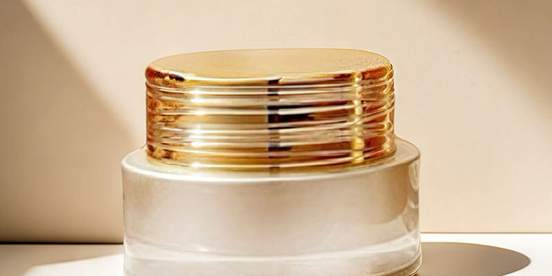 Frosted wide-mouth glass cosmetic jars with gold screw lids